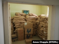 Piles of food aid, including baby formula, in storage after it was stopped from being sent to Nagorno-Karabakh in the early days of the blockade.