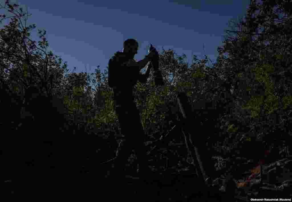 A Ukrainian soldier prepares to fire a mortar onto Russian positions near the city of Bakhmut on August 7. 