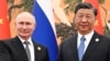 Російський лідер Володимир Путін (л) і голова Китаю Сі Цзіньпін