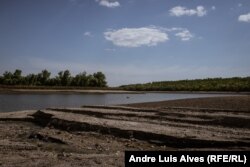 The water level is declining in a river in the Kamyanska Sich National Nature Park.