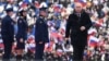 Russian President Vladimir Putin (right) attends a concert dedicated to Russian soldiers involved in the military campaign in Ukraine on the eve of Defender of the Fatherland Day at Luzhniki Stadium in Moscow on February 22.