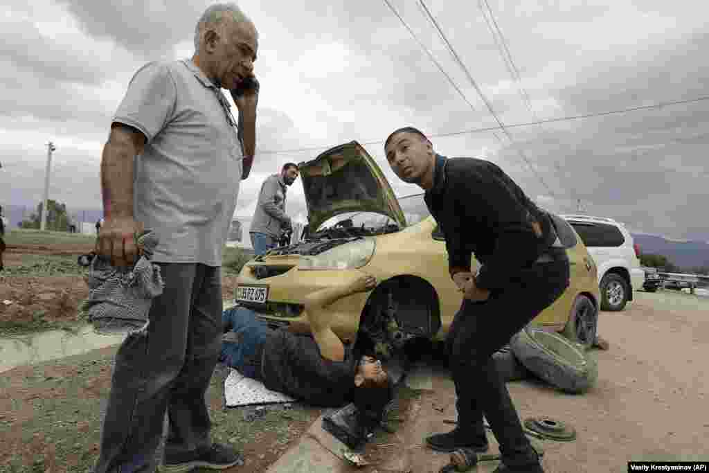 Armenian refugees repair a car on the road from Nagorno-Karabakh to Armenia. The war in 2020 ended with a Russian-brokered cease-fire and the deployment of Russian peacekeepers. Those peacekeepers did little, however, to prevent the advances by Azerbaijani forces as they launched what they called an "anti-terrorist operation" in Nagorno-Karabakh. 