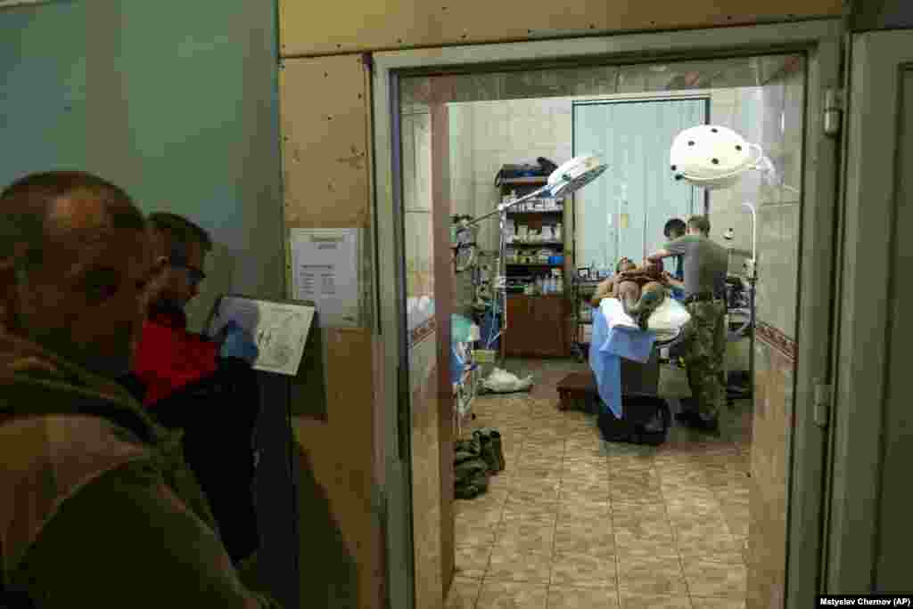 A Ukrainian soldier receives treatment at a field hospital near Bakhmut on September 10. Bakhmut fell to Russia in May, largely due to waves of attacks from mercenary Wagner fighters, including prison conscripts, thought to have died by the hundreds. Ukraine has been trying to reclaim it ever since, hoping to inflict a major psychological blow to Russia.