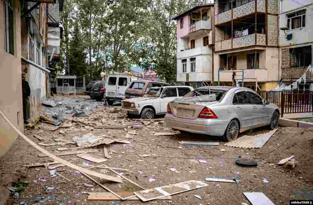 Damage is seen in a residential area after a military strike on Stepanakert. The de facto human rights ombudsman in the ethnic Armenian-controlled Azerbaijani region said early on September 20 that 32 people had been killed, including seven civilians, two of them children, and more than 200 wounded as a result of shelling, although some death estimates put the death toll considerably higher.