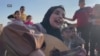 فلسطينۍ مېرمنه د موسيقۍ له لارې د جنګ ځپلو ماشومانو رواني مرسته کوي