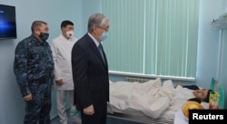 President Qasym-Zhomart Toqaev visits on January 12, 2022, with patients who were injured during the Bloody January events that swept the country and killed hundreds.