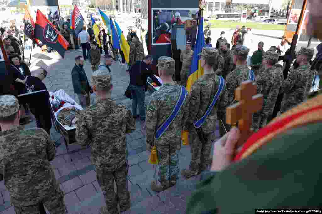 Ukrainian soldiers pay their respects. Konoval and Petryshyn died near Chasiv Yar, which has increasingly been targeted by Russian attacks. Ukraine's former commander in chief, General Valeriy Zaluzhniy, said in February that Ukraine needed up to 500,000 new recruits this year to strengthen forces and replace expected losses.