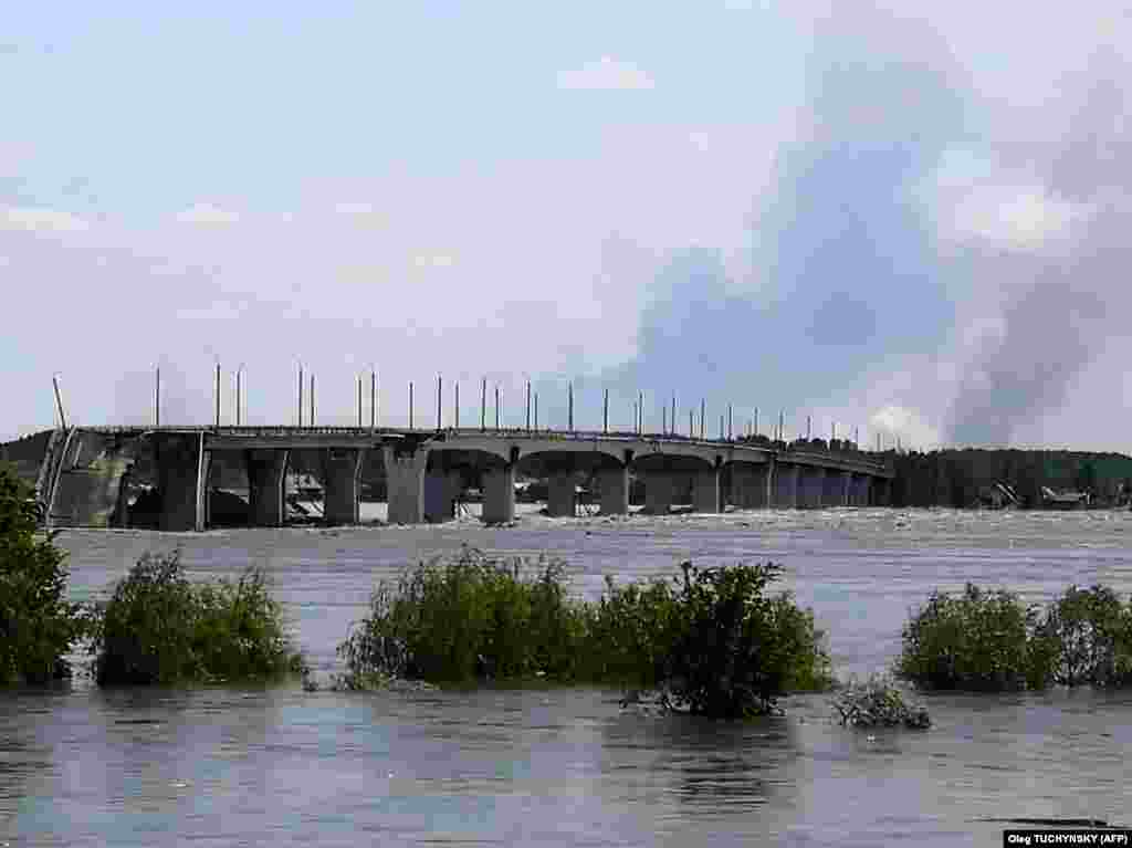 A view of rising floodwaters near the destroyed Antonivskiy Bridge on the outskirts of Kherson. 