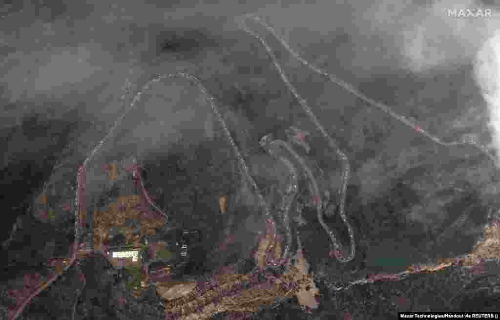 A satellite image shows a long traffic jam along the Lachin Corridor, the only route from Nagorno-Karabakh to Armenia, on September 26. The region initially came under the control of ethnic Armenian forces, backed by the Armenian military, in separatist fighting that ended in 1994. During a war in 2020, however, Azerbaijan took back large parts of Nagorno-Karabakh as well as neighboring territory held by Armenian forces. 