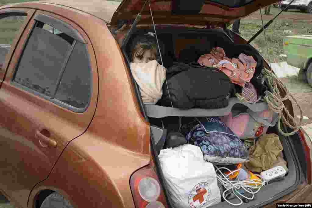 A refugee looks out from a car on the road to Armenia. Many refugees have been stuck on the road, some without enough food and water. Azerbaijan opened the road on September 24, four days after a cease-fire agreement that ended the lightning military operation. 