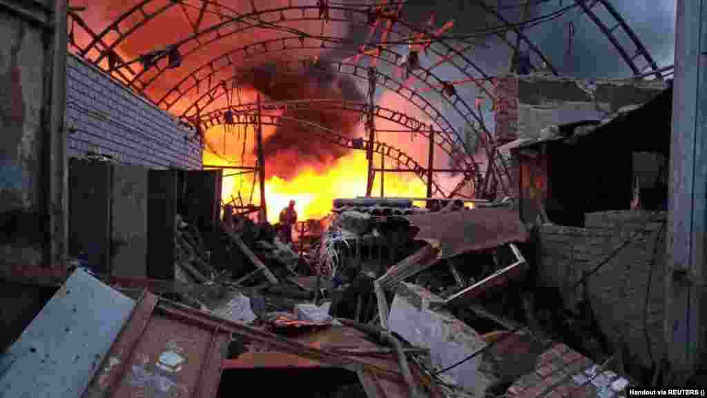 A firefighter battles a blaze at a storage facility hit by a Russian missile strike in Dnipro, eastern Ukraine. Authorities reported that a 31-year-old woman and her 2-year-old daughter were killed in the early morning strike. 
