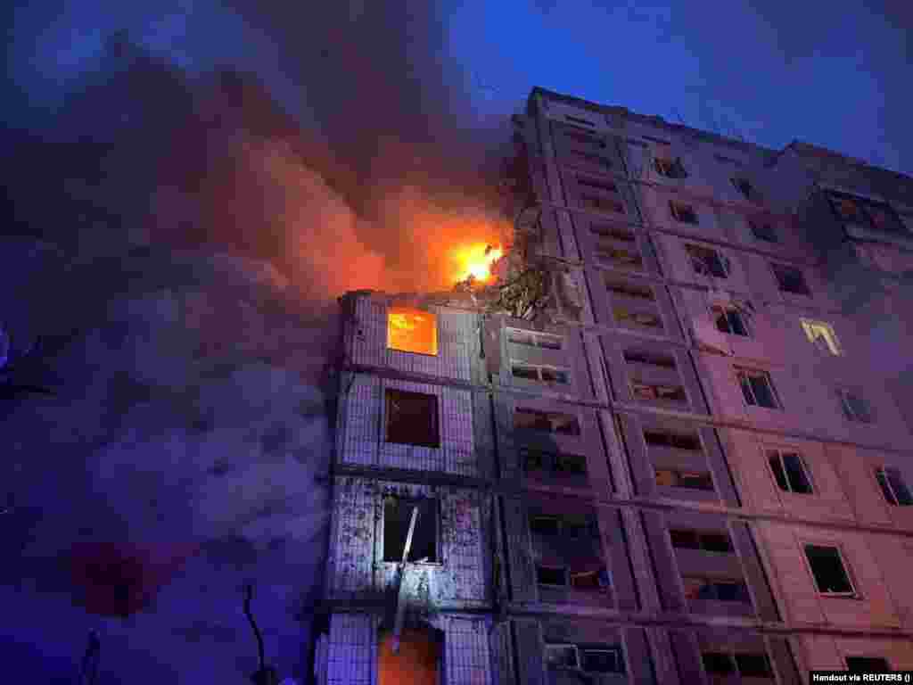A residential building in Uman burns following a Russian missile strike in the early morning of April 28. According to regional governor Igor Taburets, two cruise missiles struck the nine-story building, killing at least 10 people, including two children. 