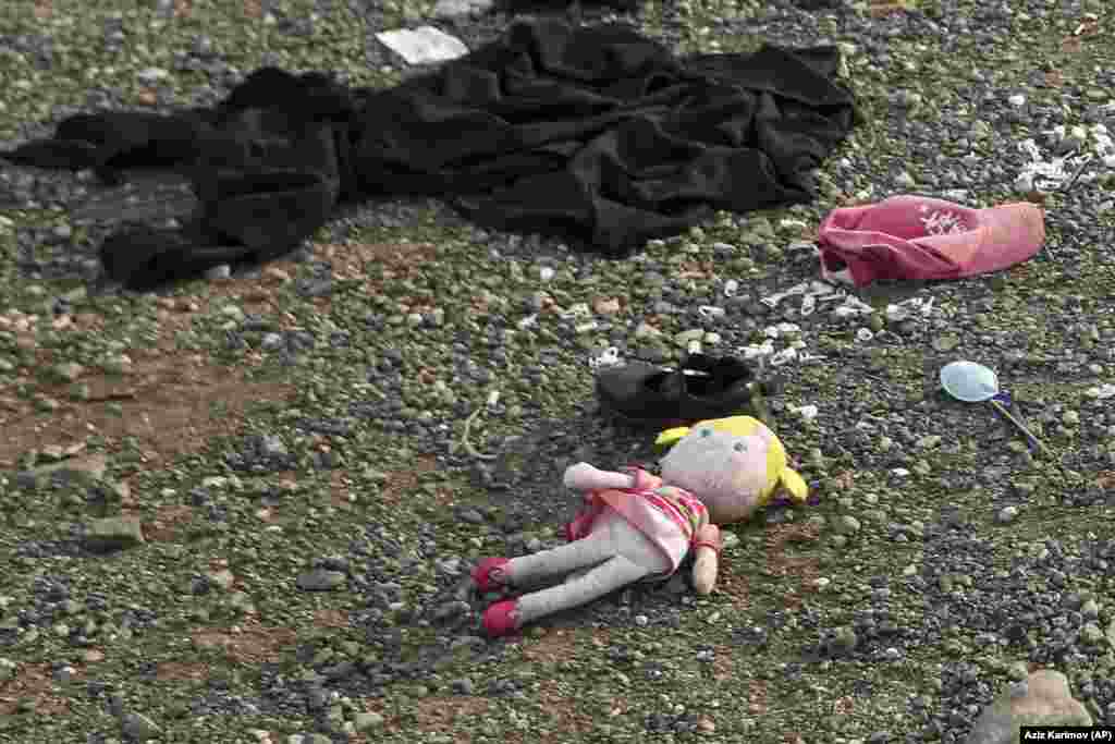 A doll and children's personal belongings lie on the ground in the regional capital, Xankendi/Stepanakert. On October 2, one of the last buses carrying ethnic Armenians from Nagorno-Karabakh left the province, capping an arduous week where 100,000 people fled following Azerbaijan's takeover of the region. 