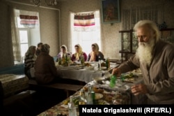 Dukhobors gather for a holiday banquet in a former orphanage, now their main hub and gathering place in Gorelovka.
