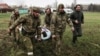 Під час відправки пораненого до Росії з Новоазовської центральної районної лікарні, квітнень 2022 року