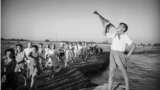 A poster of Soviet leader Josef Stalin atop one of the first tractors photographed at work in the fields of Uzbekistan.<br><br>In early 1925, the region of today’s Uzbekistan was declared a republic of the Soviet Union. The Soviet takeover marked a period of ruthless transformation, which included executions of Uzbek political prisoners as well as literacy programs and industrialization.