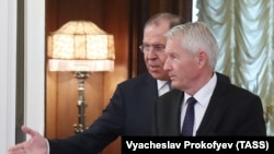 Russian Foreign Minister Sergei Lavrov (behind) welcomes Thorbjorn Jagland, secretary-general of the Council of Europe, during a meeting in Moscow on October 20.
