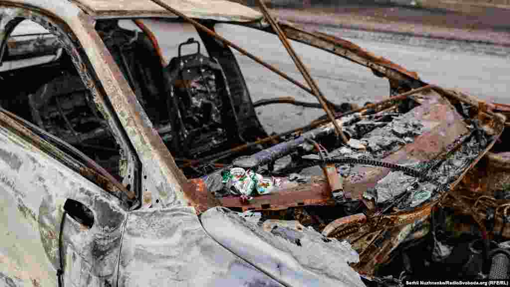Candies are set out on the car where the civilian was found dead.