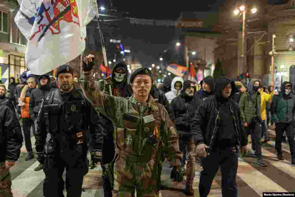 Protesters marched in Belgrade on December 12 in support of ethnic Serbs who erected barricades on the main roads in the north of Kosovo. 