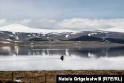 Fishermen take a boat out on a lake in Javakheti in winter.