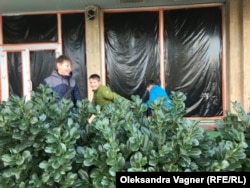 Misha (left) plays with other children from Kharkiv near a hotel in Uzhhorod, which has become their temporary home.