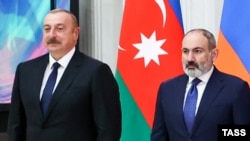 RUSSIA - Azerbaijan's President Ilham Aliyev (L) and Armenia's Prime Minister Nikol Pashinian attend a an informal CIS summit in St. Petersburg, December 26, 2022.