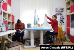 Workers produce ia blouses in Manescu's Breaza business.