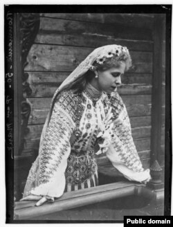 Romania's Queen Marie wears an ia blouse.