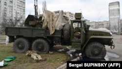 As Russian Attacks On Ukraine Intensify, Thousands Flee And Thousands Fight Back