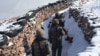 Armenian soldiers take up positions on the border with Azerbaijan.