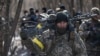 Українські військові штурмують населений пункт на Київщині, де перебувають російські сили. 10 березня 2022 року
