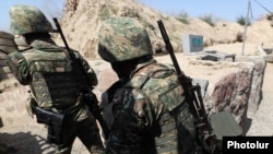 Armenian soldiers take up positions on the border with Azerbaijan in August.