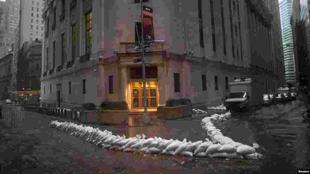 Sandbags block the entrance of the New York Stock Exchange in downtown Manhattan as Hurricane Sandy draws near the city. 