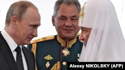 Зліва направо: російський президент Володимир Путін, міністр оборони Росії Сергій Шойгу і Московський патріарх Кирило (архівна світлина)