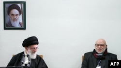 Ayatollah Ali Khamenei (left) is pictured here with a member of Egypt's Muslim Brotherhood. Khamenei says the revolts sweeping the Arab world have a spiritual kinship with Iran's own 1979 revolution. 