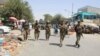 Afghan soldiers patrol in the city of Kunduz on June 25 which had been encircled by the Taliban.