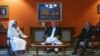 Former Afghan President Hamid Karzai (center) and former head of the Afghan reconciliation council, Abdullah Abdullah (right), meet with Qatari Foreign Minister Sheikh Mohammed bin Abdulrahman Al-Thani (left) on September 12.