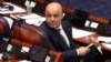 Prime Minister Dimitar Kovachevski looks back during the debate in parliament on July 16. He urged lawmakers to accept an imperfect deal that would lead to "ultimately a better future."