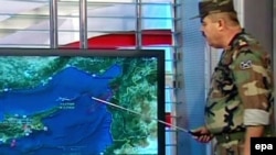 A TV grab shows a Syrian military spokesman explaining the incident involving the Turkish fighter jet.
