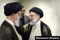Iranian Supreme Leader Ayatollah Khamenei (left) with Ebrahim Raisi (file photo)