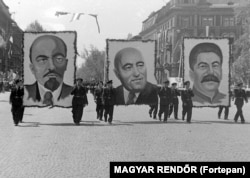 Communist leader Matyas Rakosi (center), paraded alongside portraits of Lenin and Stalin in 1950.