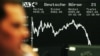 A German stock trader makes a call as stocks tumble