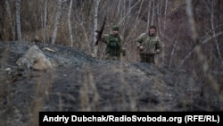 One of the flat areas of the descent from the slagheap . Guys were without ammunition and tripods, so they walked even faster. We continued to photograph them while they laughed and waved with their machineguns