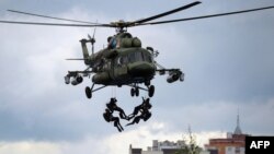 Belarusian paratroopers demonstrate their skills during exercises in the town of Brest in June.