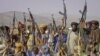 Pakistan -- Baluch rebels hold their weapons as they pose for a photograph at an undisclosed location in Baluchistan province, undated