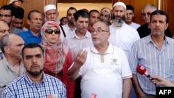 The rector of Lyon's Grand Mosque, Kamel Kabtane (center), has called for government action to counter the fear of Muslims.