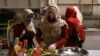 Survivors of domestic violence are seen cooking at a restaurant in Kabul established by Mary Akrami, founder of a shelter and a restaurant where women lived and worked. (file photo)
