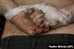 The body of a Ukrainian man -- one of many -- who was found shot dead in Bucha with his hands tied behind his back.