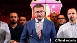 VMRO-DPMNE leader Hristijan Mickoski speaks at a press conference at party headquarters in Skopje on September 11.