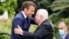 (FILES) French President Emmanuel Macron (L) welcomes Palestinian President Mahmoud Abbas before a meeting at the Elysee Presidential Palace in Paris on July 20, 2022.